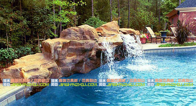 水泥假山搭配綠植樹木流水瀑布仿造自然界的壯觀奇景